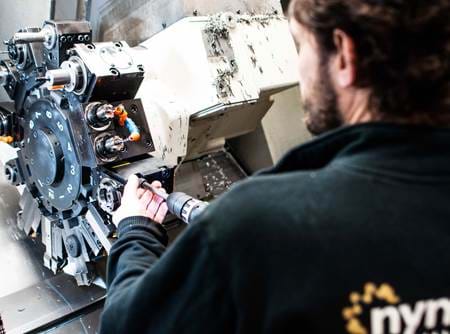 Nymas machine worker
